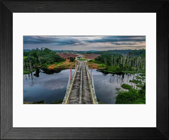 Framed Print : Aerial of a bridge cutting through the jungle to the future capital Ciudad de la Paz, Rio Muni, Equatorial Guinea, Africa Framed Print : Aerial of a bridge cutting through the jungle to the future capital Ciudad de la Paz, Rio Muni, Equatorial Guinea, Africa
