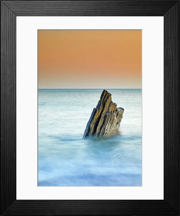 Framed Print : A sunset view of a jagged tooth-like rock, surrounded by surging sea at Ayrmer Cove, a remote cove near Kingsbridge, south coast of Devon, England, United Kingdom, Europe Framed Print : A sunset view of a jagged tooth-like rock, surrounded by surging sea at Ayrmer Cove, a remote cove near Kingsbridge, south coast of Devon, England, United Kingdom, Europe