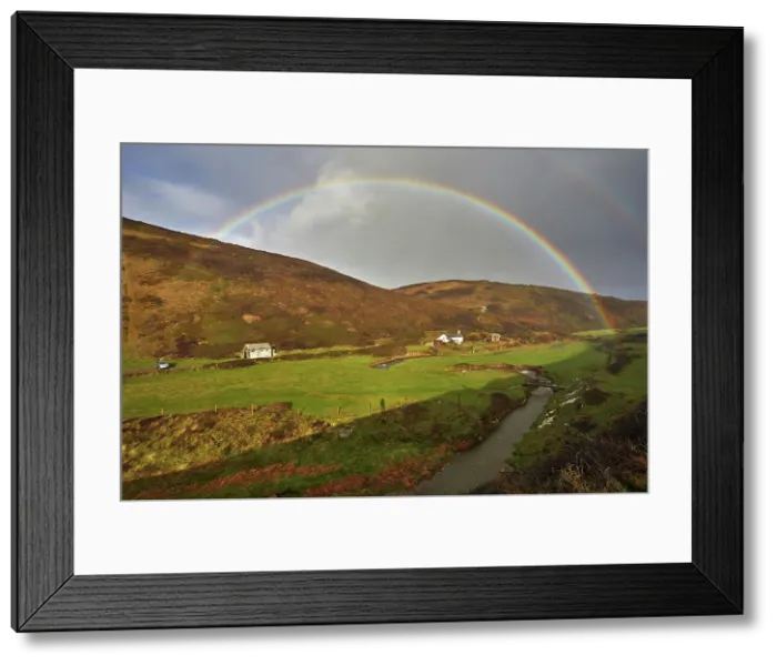 Framed Print : A valley rainbow forms in the face of an autumn squall, in Duckpool, a remote cove near Bude, north coast of Cornwall, England, United Kingdom, Europe Framed Print : A valley rainbow forms in the face of an autumn squall, in Duckpool, a remote cove near Bude, north coast of Cornwall, England, United Kingdom, Europe