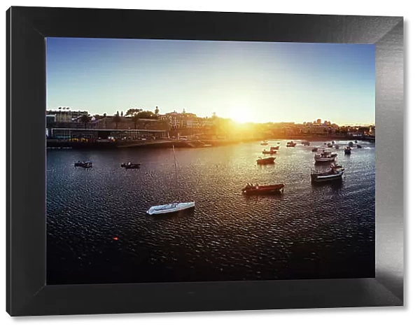 Aerial drone panoramic view of sunset at Cascais Bay, in the Lisbon region of the Portuguese Riveira, Europe