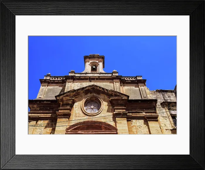 Framed Print : Malta Oratory of The Holy Cross exterior with limestone, Maltese cross and bell tower under a bright blue sky, old city of Birgu (Citta Vittoriosa), Malta, Mediterranean, Europe Framed Print : Malta Oratory of The Holy Cross exterior with limestone, Maltese cross and bell tower under a bright blue sky, old city of Birgu (Citta Vittoriosa), Malta, Mediterranean, Europe