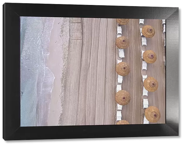 Drone view of beach straw umbrellas on an empty beach, Sicily, Mediterranean Sea, Italy, Europe