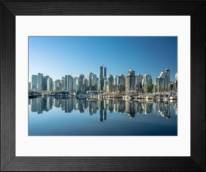 Framed Print : Skyline of Vancouver, with perfect reflection of skyscrapers in the blue waters of Stanley Park, Vancouver, British Columbia, Canada, North America Framed Print : Skyline of Vancouver, with perfect reflection of skyscrapers in the blue waters of Stanley Park, Vancouver, British Columbia, Canada, North America