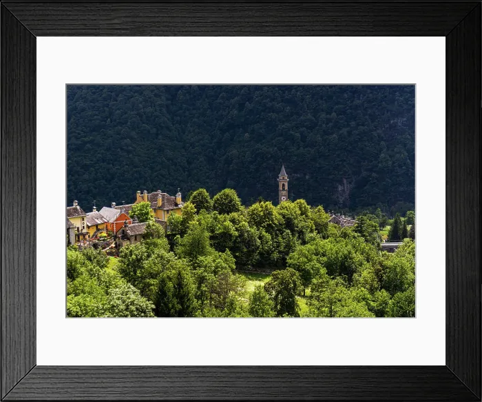 Framed Print : The township of Varzo viewed from a distance wth roof tops and spire above the alpine forest, Varzo, Piemonte (Piedmont), Northern Italy, Europe Framed Print : The township of Varzo viewed from a distance wth roof tops and spire above the alpine forest, Varzo, Piemonte (Piedmont), Northern Italy, Europe