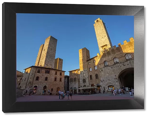 View of historic centre and towers in Piazza del Duomo, San Gimignano, UNESCO World Heritage Site, Province of Siena, Tuscany, Italy, Europe