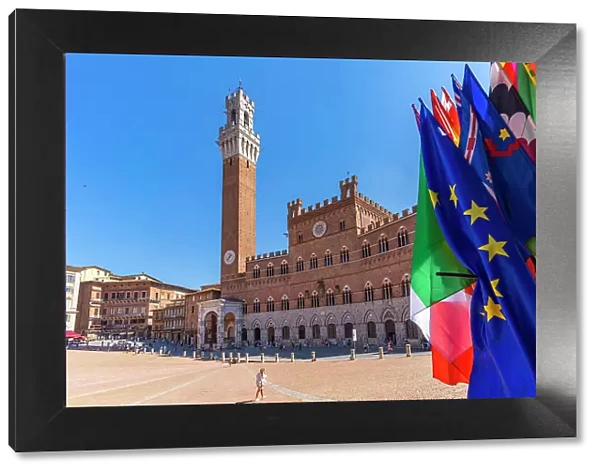 View of flags and Palazzo Pubblico in Piazza del Campo, UNESCO World Heritage Site, Siena, Tuscany, Italy, Europe