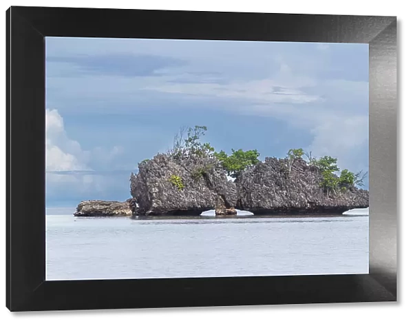 A view of limestone islets covered in vegetation in Batu Hatrim, Raja Ampat, Indonesia, Southeast Asia, Asia