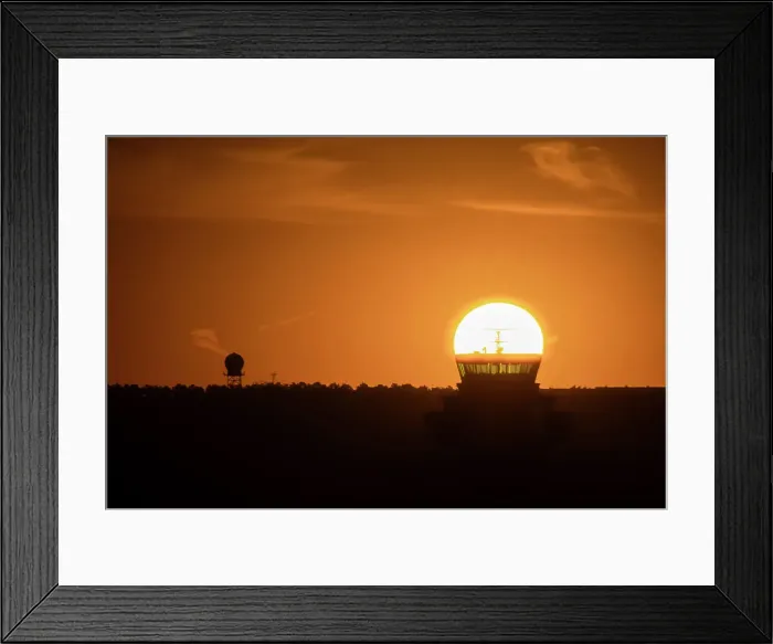 Framed Print : The sun aligned at sunrise with an airport control tower, Spain, Europe Framed Print : The sun aligned at sunrise with an airport control tower, Spain, Europe