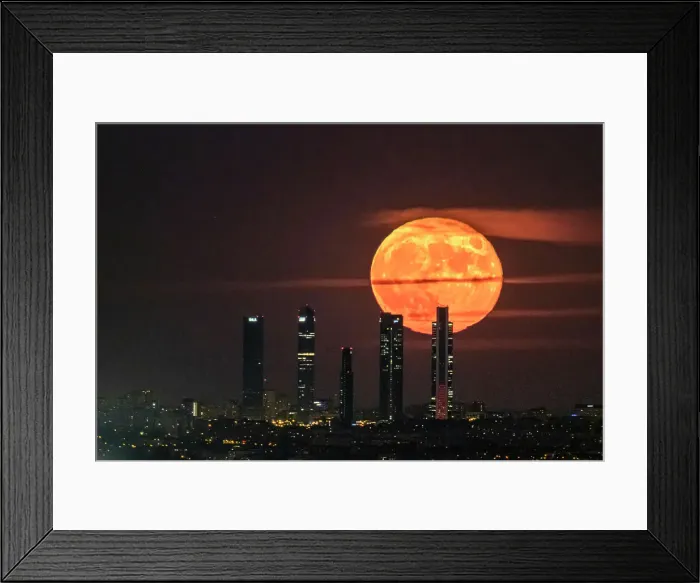 Framed Print : The Blue Moon, full moon at perigee, behind the Cuatro Torres skyscrapers in Madrid, Spain, Europe Framed Print : The Blue Moon, full moon at perigee, behind the Cuatro Torres skyscrapers in Madrid, Spain, Europe