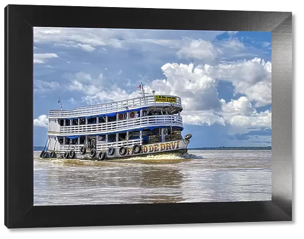 Traditional wooden boat navigating on the Rio Negro, Manaus, Amazonia State, Brazil, South America