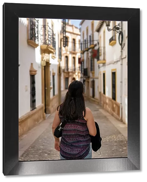 Woman in street of historic white village, Ronda, Pueblos Blancos, Andalusia, Spain, Europe