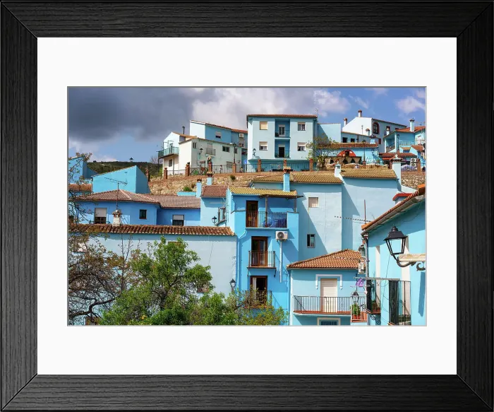 Framed Print : Village street in blue painted Smurf house village of Juzcar, Pueblos Blancos region, Andalusia, Spain, Europe Framed Print : Village street in blue painted Smurf house village of Juzcar, Pueblos Blancos region, Andalusia, Spain, Europe