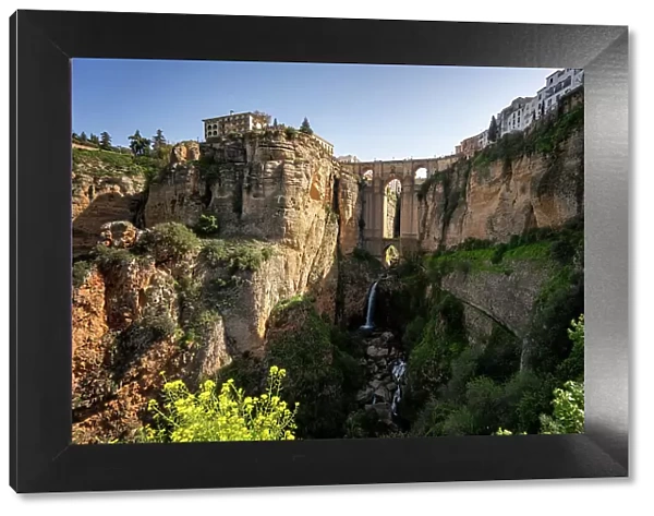 View with beautiful bridge and waterfall, a traditional white village, Ronda, Pueblos Blancos, Andalusia, Spain, Europe