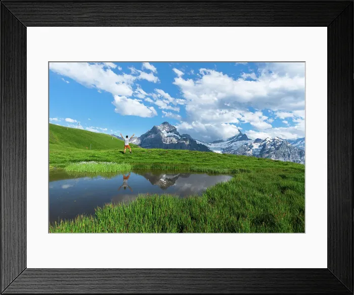Framed Print : Happy hiker reflecting in the water of a small lake below the Bernese Oberland mountains, Bachalpsee, Grindelwald, Bern canton, Switzerland, Europe Framed Print : Happy hiker reflecting in the water of a small lake below the Bernese Oberland mountains, Bachalpsee, Grindelwald, Bern canton, Switzerland, Europe
