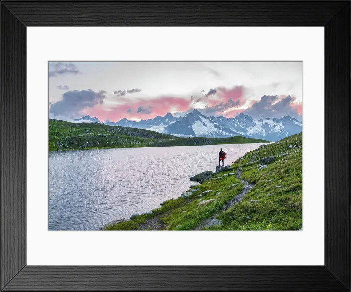 Framed Print : Hiker stands near the shore of Fenetre lake admiring the sunset over the massif of Mount Blanc, Ferret valley, Valais canton, Col du Grand-Saint-Bernard (St. Bernard mountain pass), Switzerland, Europe Framed Print : Hiker stands near the shore of Fenetre lake admiring the sunset over the massif of Mount Blanc, Ferret valley, Valais canton, Col du Grand-Saint-Bernard (St. Bernard mountain pass), Switzerland, Europe