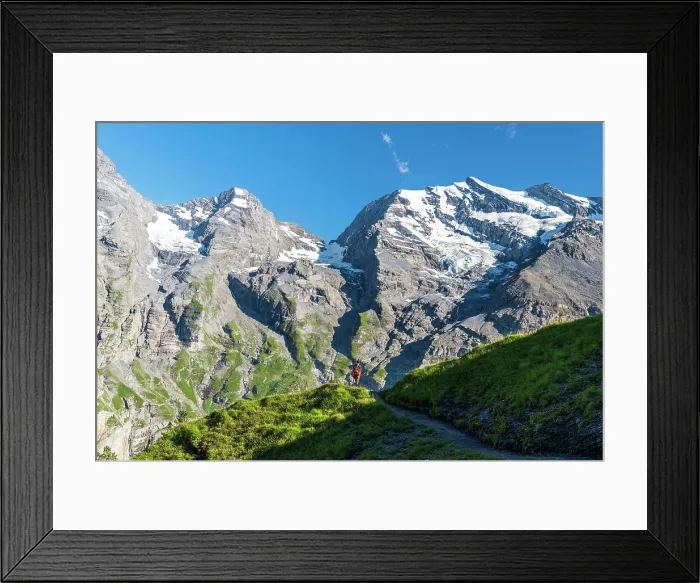 Framed Print : Hiker walks the summer trail surrounded by Swiss glacier, Oeschinensee, Kandersteg, Bern Canton, Switzerland, Europe