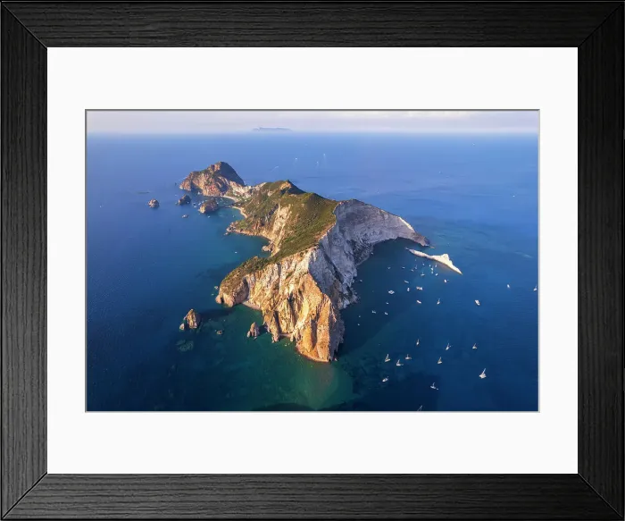 Framed Print : Aerial view of the island of Palmarola, with boats anchored in the blue waters of Brigantina bay, Palmarola island, Ponza municipality, Tyrrhenian Sea, Pontine islands, Latina Province, Latium (Lazio), Italy, Europe Framed Print : Aerial view of the island of Palmarola, with boats anchored in the blue waters of Brigantina bay, Palmarola island, Ponza municipality, Tyrrhenian Sea, Pontine islands, Latina Province, Latium (Lazio), Italy, Europe