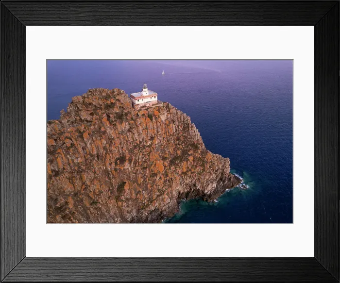 Framed Print : Punta della Guardia basalt cliff with the lighthouse at dusk, Ponza island, Tyrrhenian Sea, Pontine islands, Latina Province, Latium (Lazio), Italy, Europe