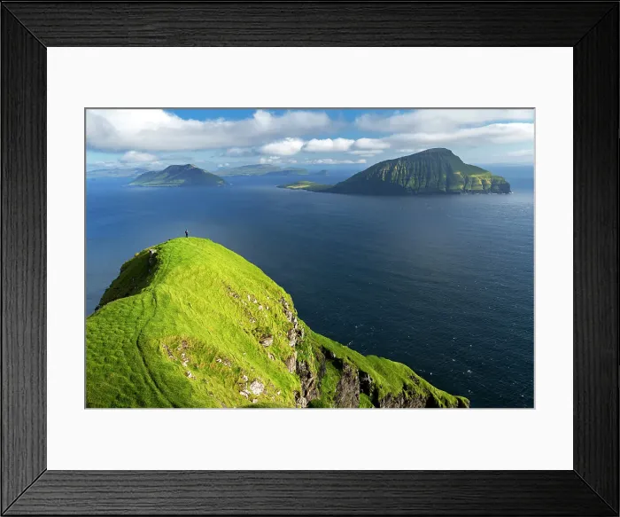 Framed Print : Hiker walks on top of a tall cliff overlooking the ocean, Nordradalur, Streymoy island, Faroe islands, Denmark, Europe Framed Print : Hiker walks on top of a tall cliff overlooking the ocean, Nordradalur, Streymoy island, Faroe islands, Denmark, Europe