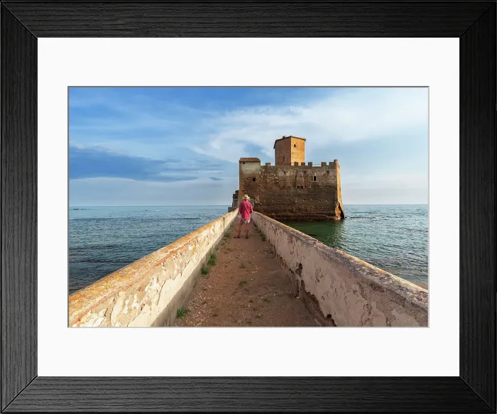 Framed Print : Tourist standing on top of the boardwalk admiring Torre Astura Castle, Nettuno municipality, province of Rome, Tyrrhenian sea, Latium (Lazio), Italy, Europe Framed Print : Tourist standing on top of the boardwalk admiring Torre Astura Castle, Nettuno municipality, province of Rome, Tyrrhenian sea, Latium (Lazio), Italy, Europe