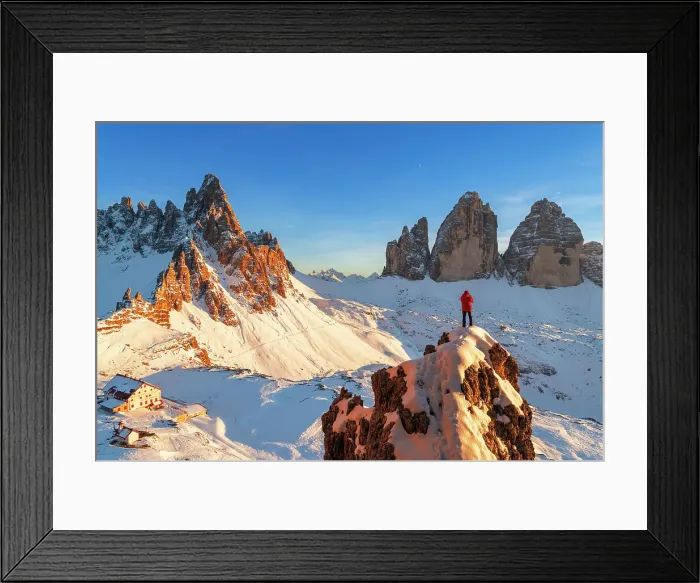 Framed Print : Rear view of a hiker admiring Tre Cime di Lavaredo (Lavaredo Peaks) (Drei Zinnen) from the top of a giant rock, winter view, Sesto (Sexten), Dolomites, South Tyrol, Italy, Europe Framed Print : Rear view of a hiker admiring Tre Cime di Lavaredo (Lavaredo Peaks) (Drei Zinnen) from the top of a giant rock, winter view, Sesto (Sexten), Dolomites, South Tyrol, Italy, Europe
