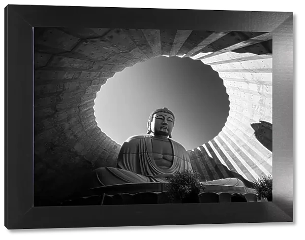 Black and White of a Buddha statue framed in circular architecture, Hill of the Buddha, Sapporo, Hokkaido, Japan, Asia