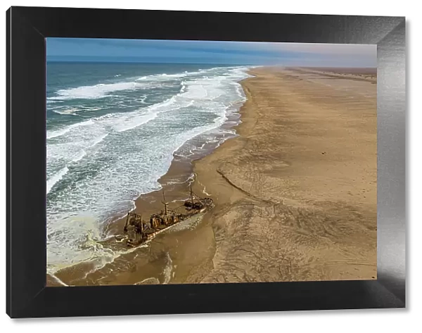 Aerial of a shipwreck on a beach in the Iona National Park, Namibe, Angola, Africa