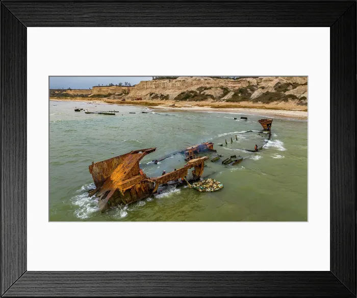 Framed Print : Men dismantling a boat on Shipwreck beach, Bay of Santiago, Luanda, Angola, Africa Framed Print : Men dismantling a boat on Shipwreck beach, Bay of Santiago, Luanda, Angola, Africa