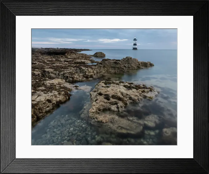 Framed Print : Rocks and Trwyn Du Lighthouse at dawn, Penmon Point, Anglesey, Wales, United Kingdom, Europe