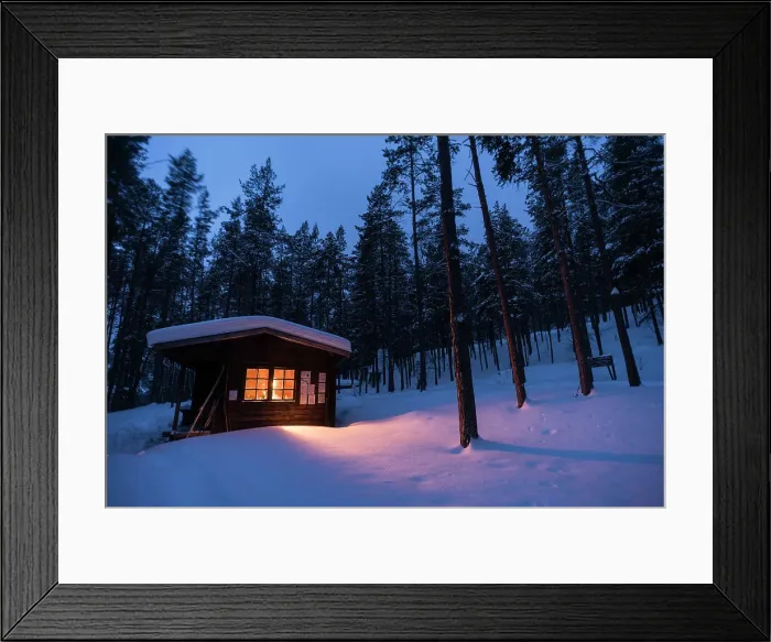 Framed Print : Log cabin with fire inside, winter, Lemmenjoki National Park, Finland, Europe