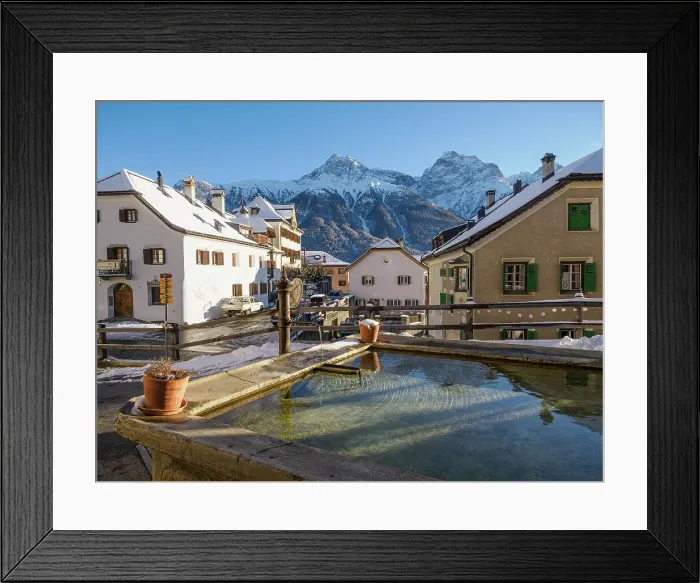 Framed Print : A plaza and fountain in the Alpine village of Sent in winter, Sent, Switzerland, Europe Framed Print : A plaza and fountain in the Alpine village of Sent in winter, Sent, Switzerland, Europe