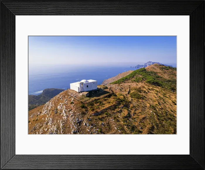 Framed Print : Aerial view of the white Chapel of San Costanzo on top of a mountain surrounding the sea of Amalfi coast, Punta Campanella, Massa Lubrense municipality, Naples province, Campania region, Italy, Europe Framed Print : Aerial view of the white Chapel of San Costanzo on top of a mountain surrounding the sea of Amalfi coast, Punta Campanella, Massa Lubrense municipality, Naples province, Campania region, Italy, Europe
