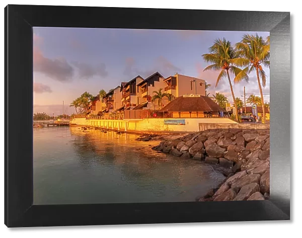 View of waterside apartments in Grand Bay at sunset, Mauritius, Indian Ocean, Africa