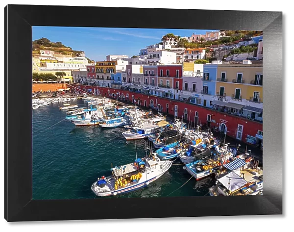 Aerial view of the colorful Italian village of Ponza with fishing vessels in the foreground, Pontine Islands, Latina province, Tyrrhenian Sea, Latium (Lazio), Italy, Europe