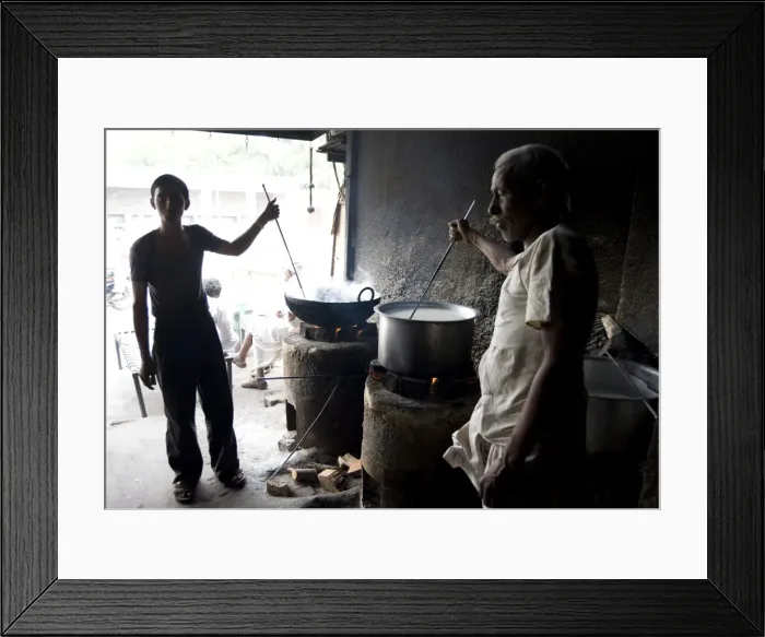 Framed Print : Young man and blind man stirring milk for chai, roadside chai stall, Dangiyawas