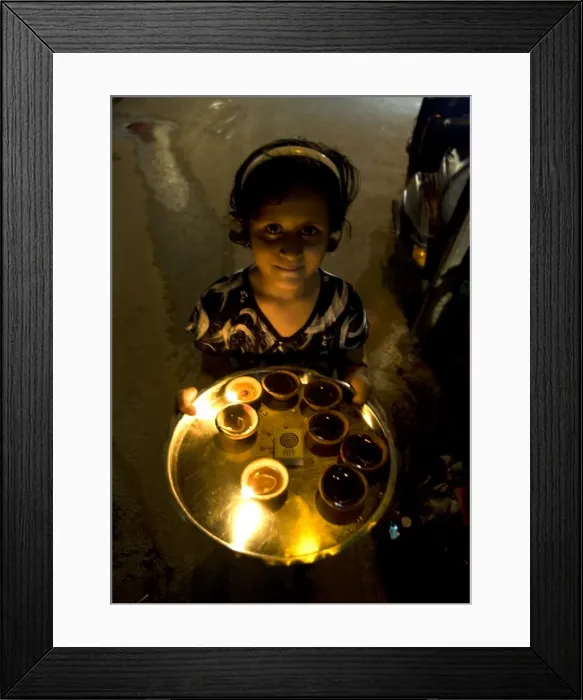Framed Print : Young girl carrying deepak lights on tray at Diwali, Udaipur, Rajasthan, India, Asia Framed Print : Young girl carrying deepak lights on tray at Diwali, Udaipur, Rajasthan, India, Asia