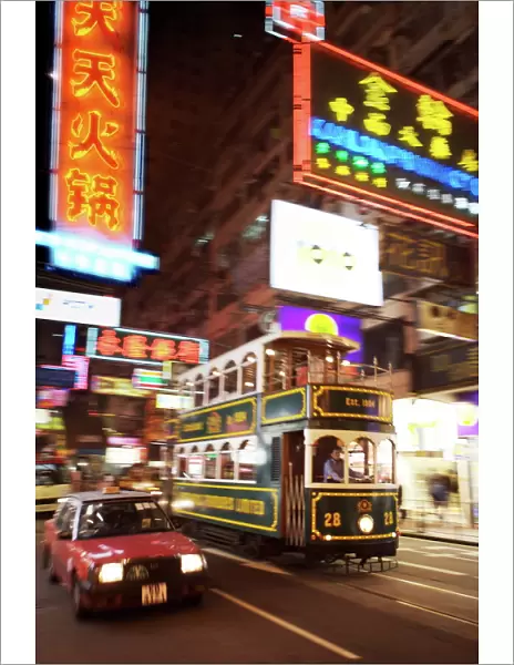 Tram and taxi with neon lights, Hong Kong, China, Asia