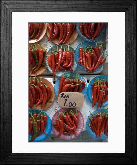 Framed Print : Colourful red chillies on blue plates on a market stall in Kuching, Sarawak