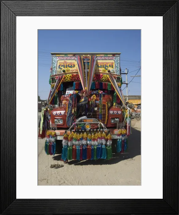 Framed Print : Man fixing decoration onto truck for Diwali celebrations, Pali district Framed Print : Man fixing decoration onto truck for Diwali celebrations, Pali district