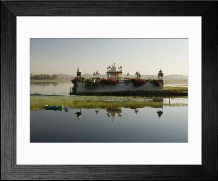Framed Print : Reflection of temple in lake at dusk, with boat, Dungarpur, Rajasthan, India, Asia Framed Print : Reflection of temple in lake at dusk, with boat, Dungarpur, Rajasthan, India, Asia