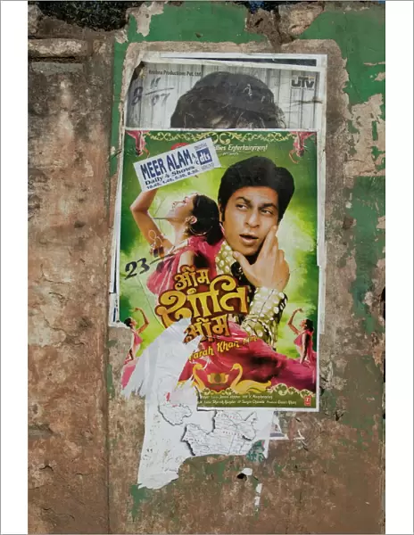Shahruk Khan in torn Bollywood movie poster on wall, Hospet, Karnataka, India, Asia