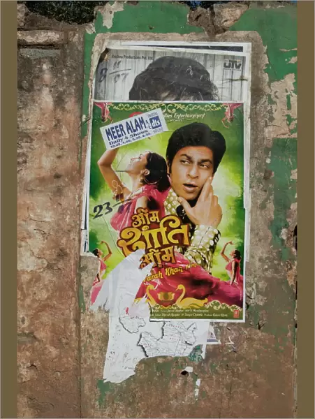 Shahruk Khan in torn Bollywood movie poster on wall, Hospet, Karnataka, India, Asia