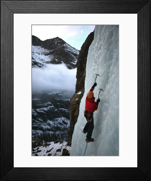 Framed Print : An ice climber makes his way up a frozen waterfall near Cogne, above the Aosta Valley Framed Print : An ice climber makes his way up a frozen waterfall near Cogne, above the Aosta Valley