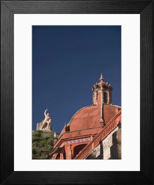 Framed Print : Dome of the Temple of San Diego in foreground, with monument to El Pipila beyond