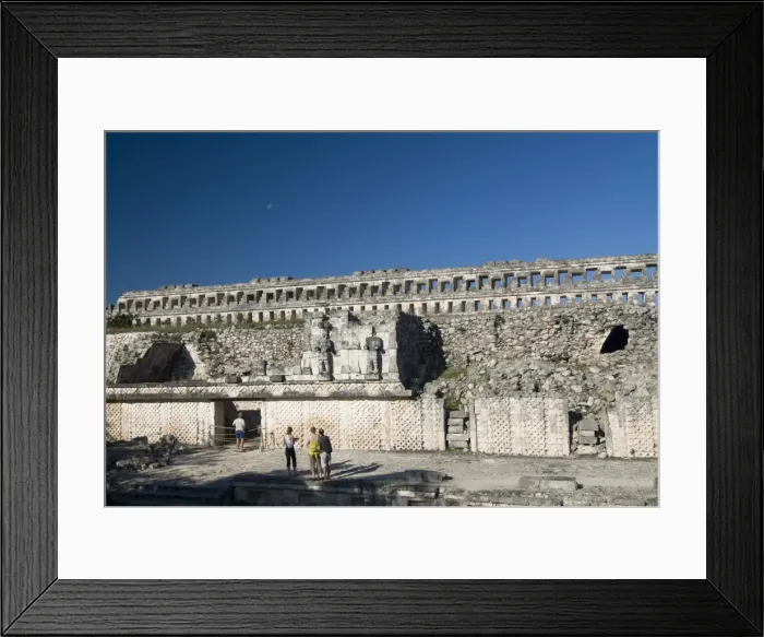 Framed Print : Tourists in front of the unusual restored Atlantes stone carved male figures at rear of the Palace of Masks, Kabah, Yucatan, Mexico Framed Print : Tourists in front of the unusual restored Atlantes stone carved male figures at rear of the Palace of Masks, Kabah, Yucatan, Mexico