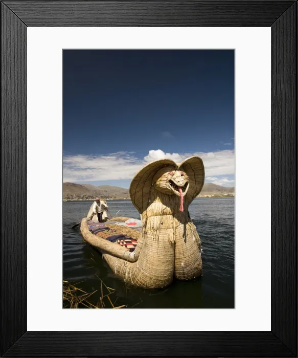 Framed Print : Reed boat with decorative bow, amid floating islands of the Uros people Framed Print : Reed boat with decorative bow, amid floating islands of the Uros people
