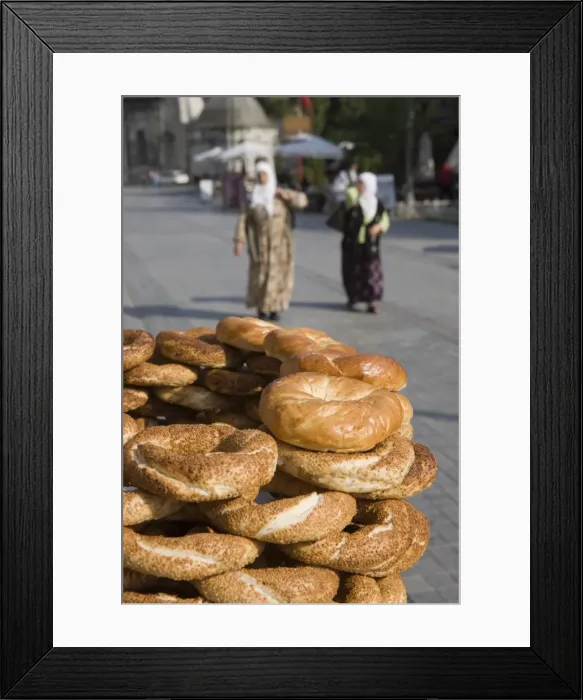 Framed Print : Traditional Turkish bagels with sesame seeds for sale, ladies in traditional costume in distance Framed Print : Traditional Turkish bagels with sesame seeds for sale, ladies in traditional costume in distance