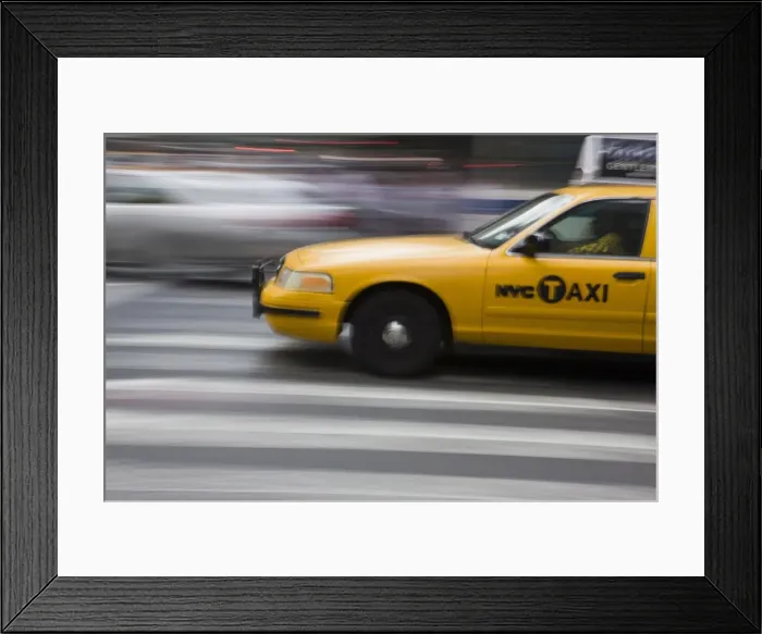Framed Print : New York taxi cab driving fast over a pedestrian crossing, Manhattan, New York Framed Print : New York taxi cab driving fast over a pedestrian crossing, Manhattan, New York