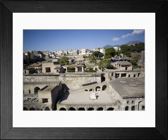 Framed Print : View over the Ecolano excavations with Mount Vesuvius in the background Framed Print : View over the Ecolano excavations with Mount Vesuvius in the background