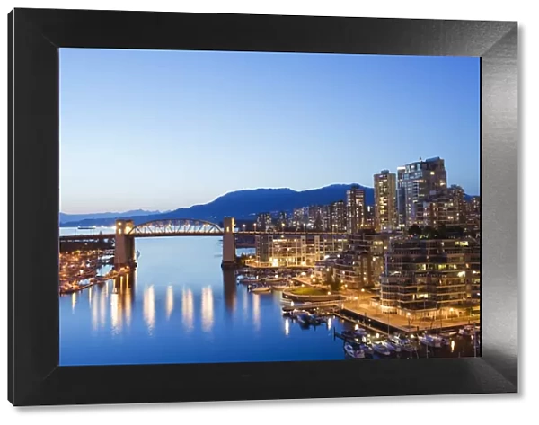 Illuminated buildings in False Creek Harbour, Vancouver, British Columbia